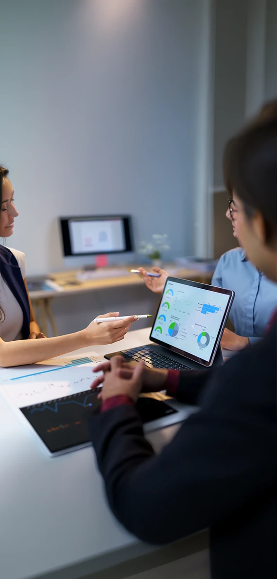 Business professionals reviewing chart analytics gathered from online focus groups and interviews.