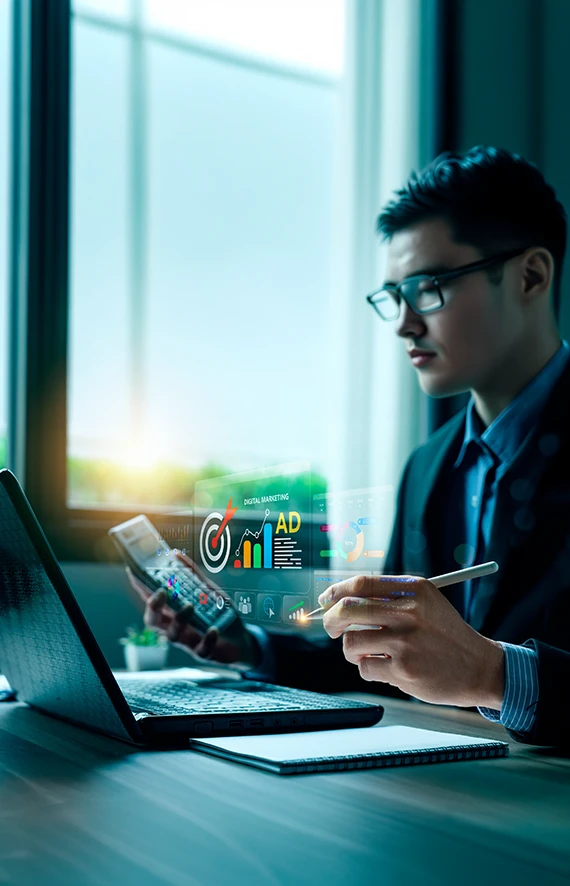 Product Placement Research expert using digital marketing analytics on a laptop and smartphone