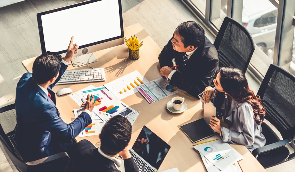 Business Planning Consultants analysing market trends with executives