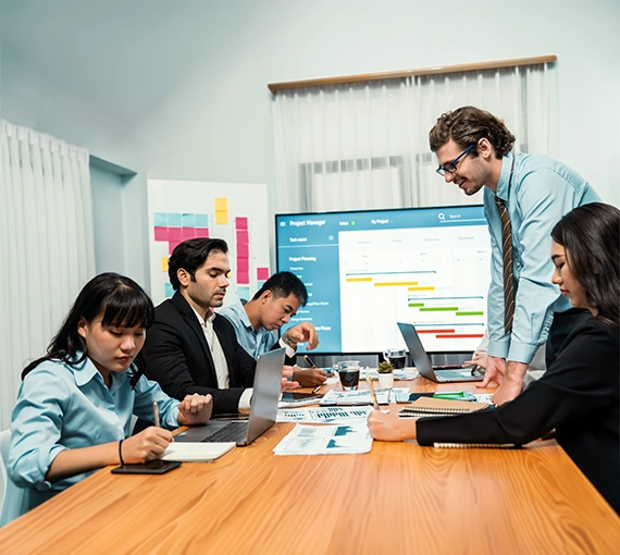 Market Research Methodology UAE team discussing research planning, data collection, and project strategy in a business meeting.